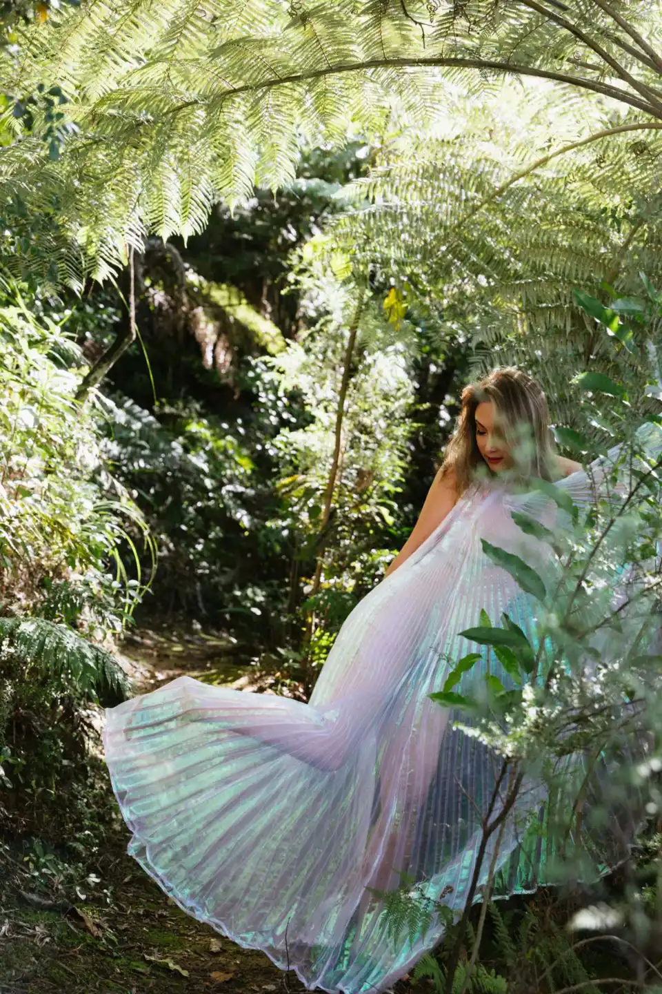 Tanya in a dress among ferns