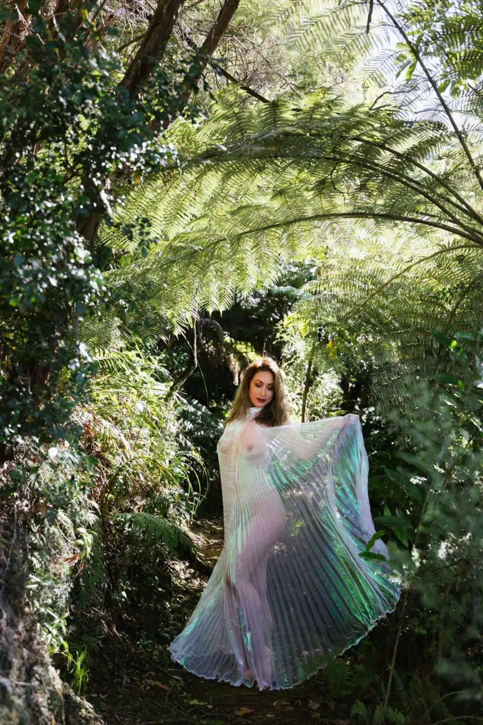 Tanya in a sheer veil among ferns
