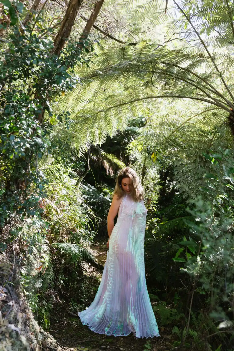 Tanya in a dress among ferns, second pose